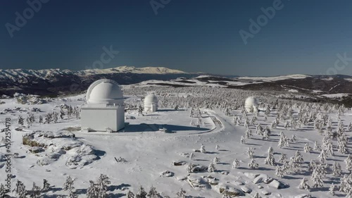 Aerial footage of snowy astronomical observatory in Calar Alto after snowfall , Sierra de los Filabres, Almeria, Spain