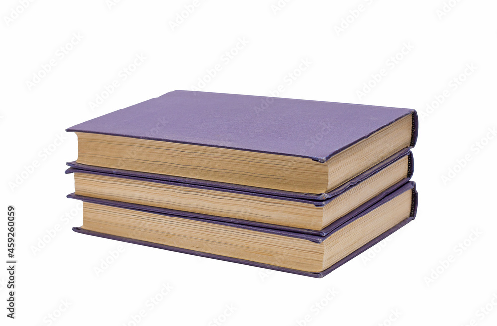 Three books in a purple binding, isolated on a white background. Three books in a purple binding, isolated on a white background.
