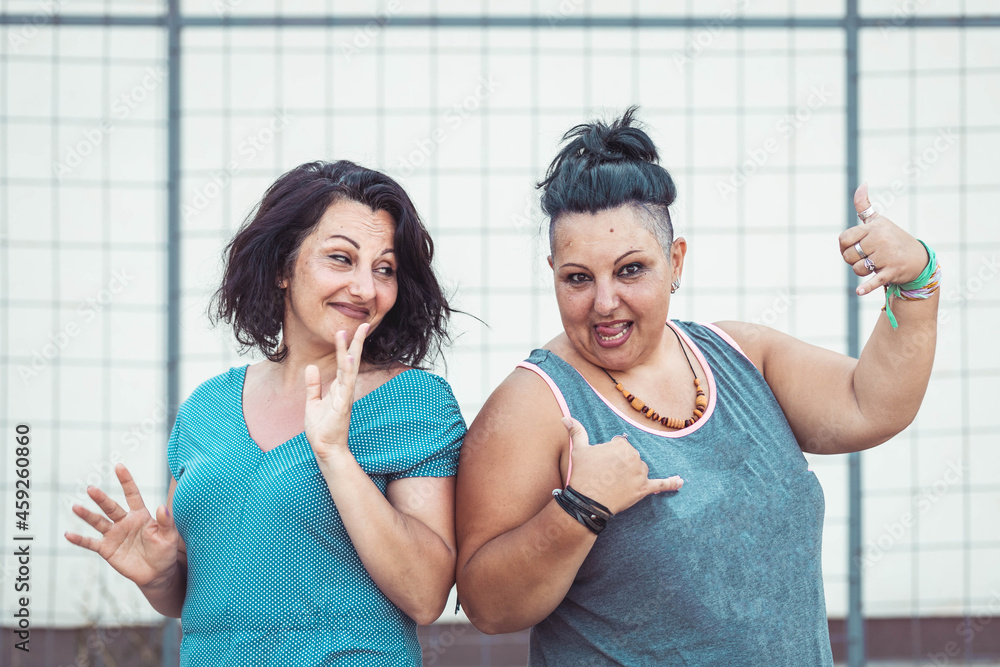 Two adult twin sisters having fun. Positive vibes Two adult twin sisters having fun. Positive vibes