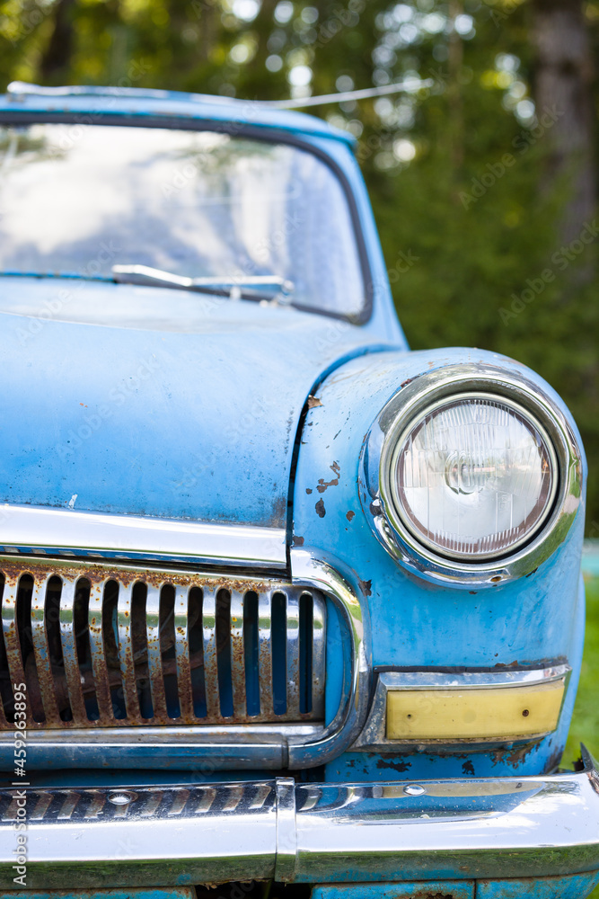 Close-up of old sixties rusty blue car