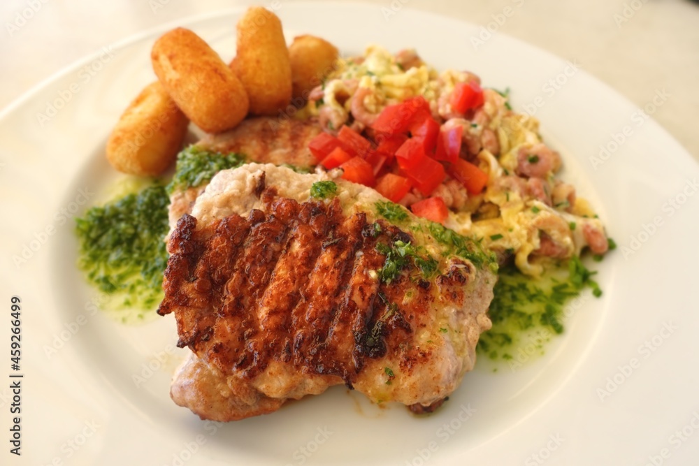 Grilled meat with scrambled eggs and potato Grilled meat with scrambled eggs and potato