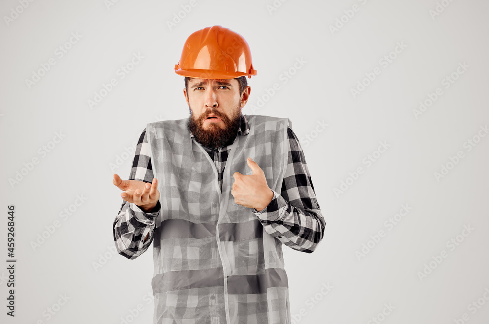 emotional man in orange hard hat construction professional light background emotional man in orange hard hat construction professional light background