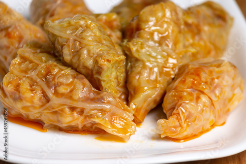 Typical Moldovan and Romanian dish. Cabbage rolls stuffed with meat, rice and vegetables with sour cream. Sarmale. photo