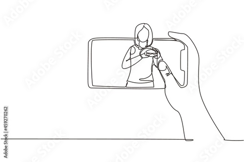 Continuous one line drawing woman food blogger eating burger while creating new content video for her channel by using smartphone. Food review blogger. Single line draw design vector illustration