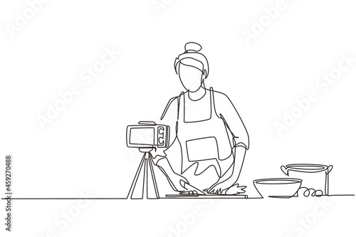 Single continuous line drawing food blogger. Chef cooking, recording video using camera. Online channel, stream. Woman teaches cooking new recipe. Culinary show. One line draw graphic design vector