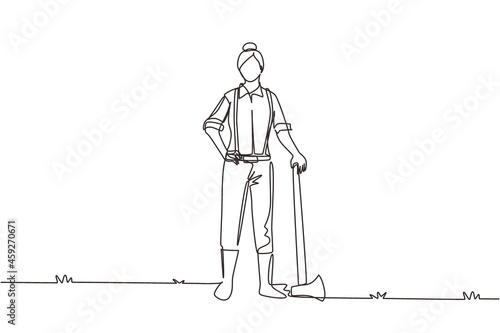Single one line drawing woman lumberjack with axe standing wearing suspender shirt, jeans and boots. Female woodcutter pose on logging forest. Continuous line draw design graphic vector illustration