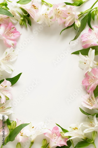 Flowers frame background top view with copy space. Alstroemeria flowers backdrop. Poster