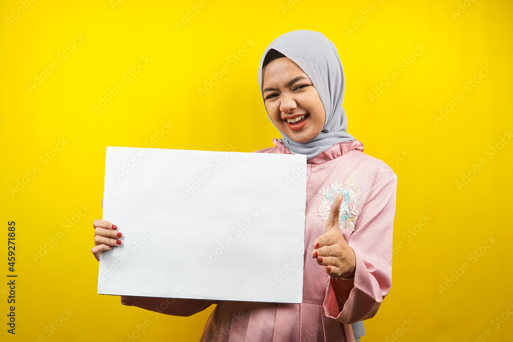 Pretty young muslim woman cheerful holding blank empty banner, placard, white board, blank sign board, white advertisement board, presenting something in copy space, promotion Pretty young muslim woman cheerful holding blank empty banner, placard, white board, blank sign board, white advertisement board, presenting something in copy space, promotion