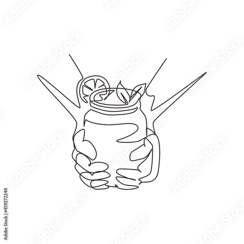 Single continuous line drawing hands hold refreshing detox lemonade drink with sliced lime, lemon, mint. Summer delicious lemonade in a vintage mug. One line draw graphic design vector illustration