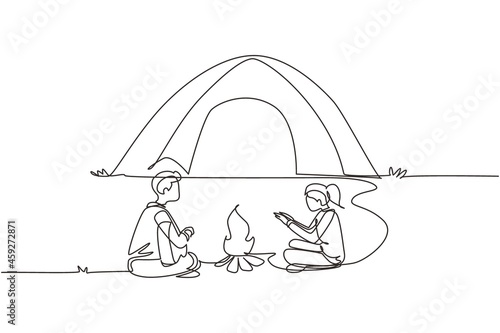 Single one line drawing couple camping around campfire tents. Man woman warm their hands near bonfire, man playing guitar. Nature exploration trip. Continuous line draw design vector illustration