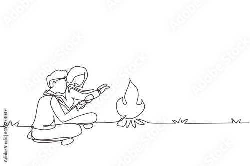 Single continuous line drawing romantic couple camping around campfire tents. Man woman warm their hands near bonfire sitting on ground. Nature trip. One line draw graphic design vector illustration
