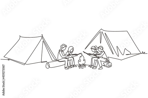 Single continuous line drawing friends sit on logs by campfire. Young tourists, campers in forest. Students roast marshmallows. Night camping entertainment. One line draw design vector illustration