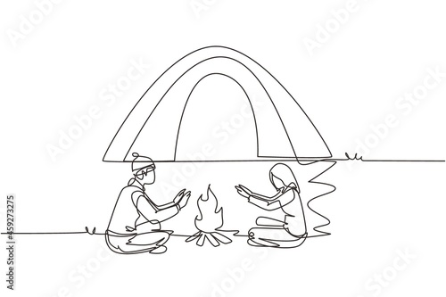 Single continuous line drawing traveling couple active recreation camping around campfire tents. Man and woman warm their hands near bonfire. Dynamic one line draw graphic design vector illustration