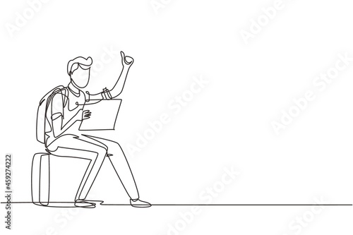 Single one line drawing man with backpacks sitting near road and hitchhiking. Male thumbing or hitching ride. Adventure travel, road trip, tourism. Continuous line draw design vector illustration