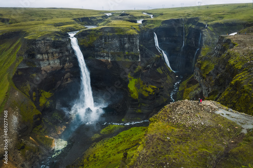 Dramatic landscape of epic Haifoss Waterfall in Landmannalaugar canyon, Iceland. Aerial panoramic drone view
