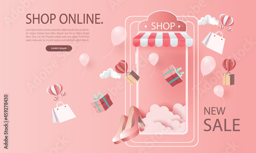 paper art shopping online on smartphone and new buy sale promotion pink backgroud for banner market ecommerce women concept.
