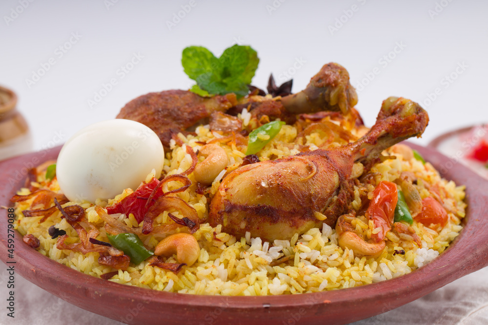 Chicken biryani , kerala style chicken dhum biriyani made using jeera rice and spices arranged