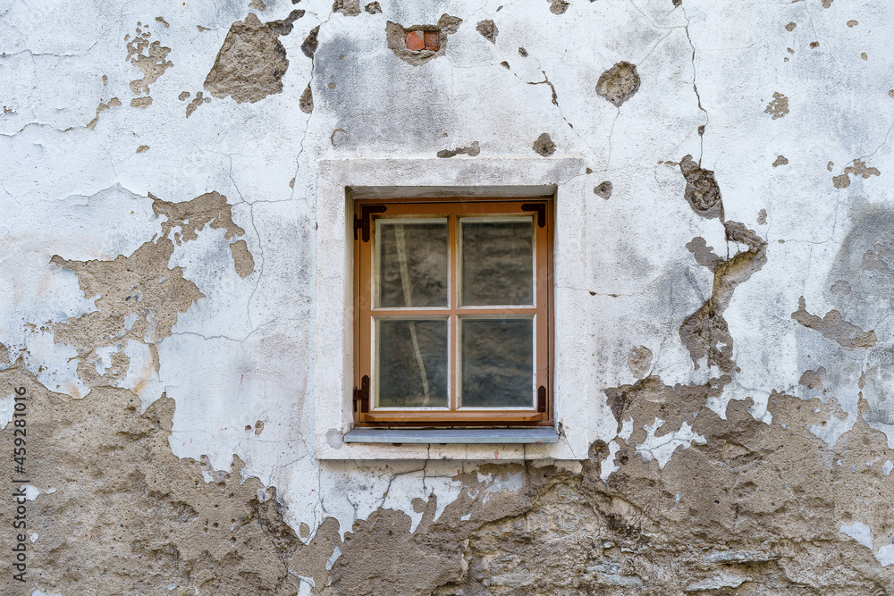 Small window in very old medieval and dilapidated building. Small window in very old medieval and dilapidated building.