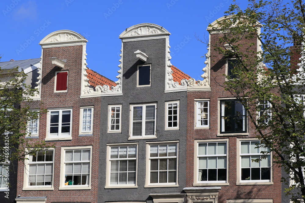 Amsterdam Traditional Canal House Facades Close Up with Decorated Neck Gables, Netherlands
