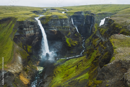 Dramatic landscape of epic Haifoss Waterfall in Landmannalaugar canyon, Iceland. Aerial panoramic drone view