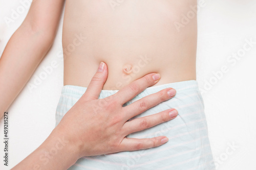 Wallpaper Mural The surgeon examines the patient's abdominal cavity for the presence of an umbilical hernia. The concept of an abdominal wall disease with an umbilical hernia. Stomach pain. Torontodigital.ca