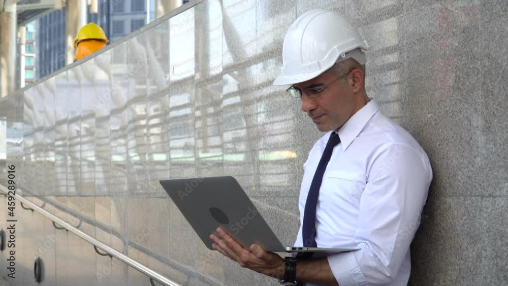 senior architect checking list construction site with laptop computer outdoors . old contractor worker or builder Inspection . Engineer or foreman . quality control .Building inspector senior architect checking list construction site with laptop computer outdoors . old contractor worker or builder Inspection . Engineer or foreman . quality control .Building inspector