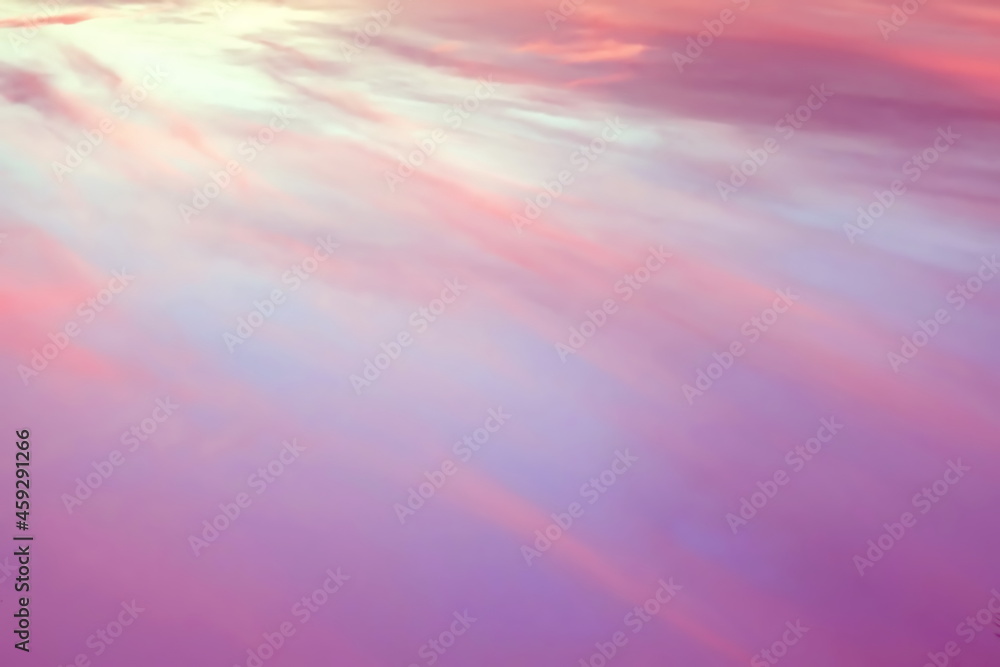 Pastel pink and purple sky and clouds in the evening as the sun sets. The twilight sky is beautiful, calm and sweet.
