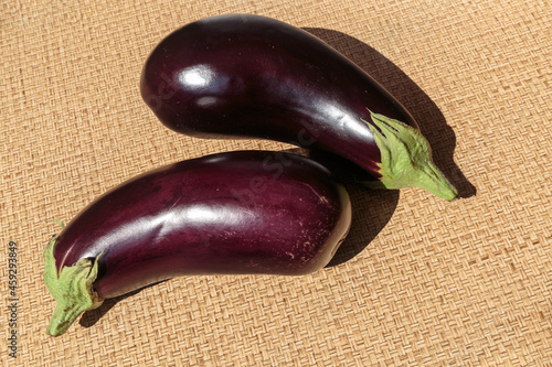 Two fresh ripe eggplants closeup.
