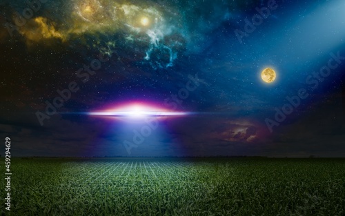 Fototapeta Naklejka Na Ścianę i Meble -  Scenic sci-fi image - ufo inspect green grass field with bright spotlight in dark night sky. Nebula and full moon in starry sky.