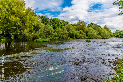 A view beside the Arthington Viaduct down the River Wharfe in Yorkshire, UK in summertime