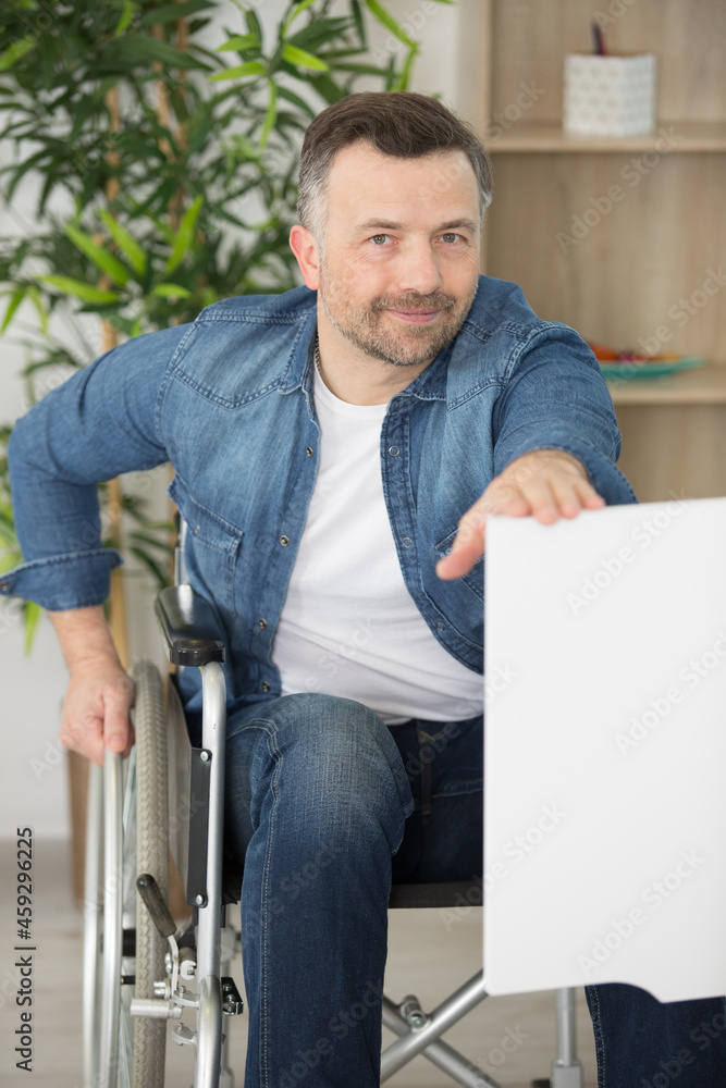 confident disabled man on wheelchair smiling at camera confident disabled man on wheelchair smiling at camera