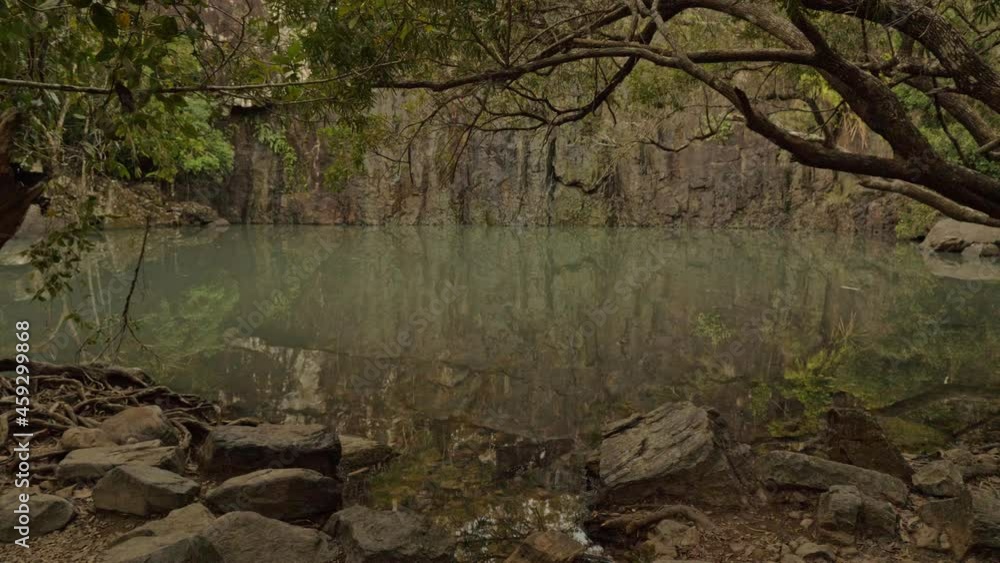 Small quiet pool lake of Cedar Creek Falls in the forest -Queensland, Australia Small quiet pool lake of Cedar Creek Falls in the forest -Queensland, Australia