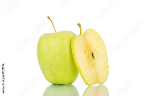 One slice and one ripe sweet apple, close-up, isolated on white.