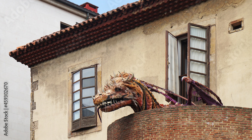 the dragon gazes from the balcony, Gijon, Asturias, Spain
