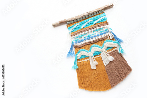 Beautiful handmade wall hanging on white background.