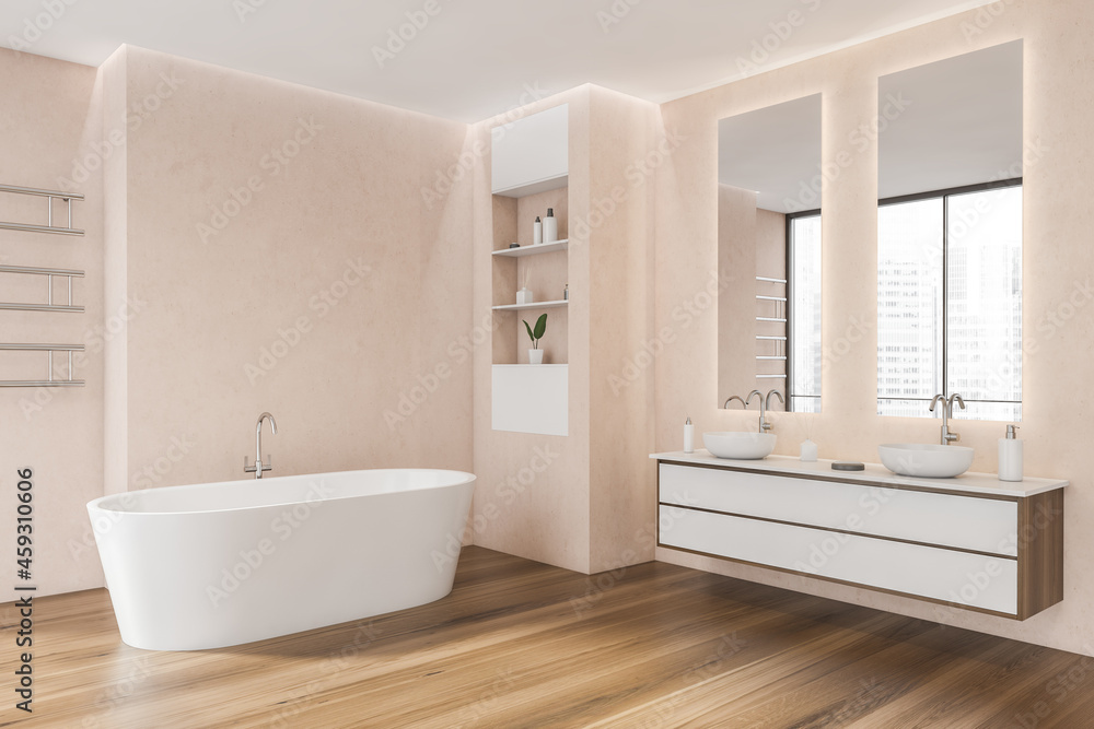 Pink bathroom with oval white ceramic bathtub. Corner view Pink bathroom with oval white ceramic bathtub. Corner view