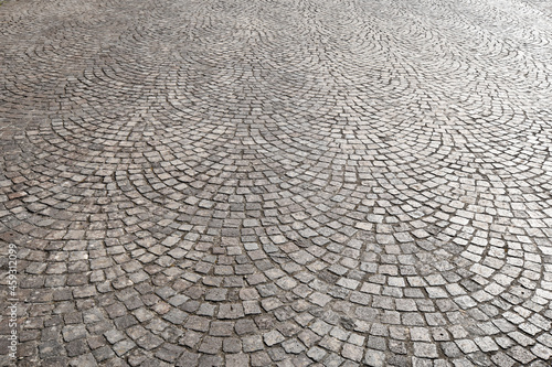 detail of the pavement in porphyry stone. cobblestones paving