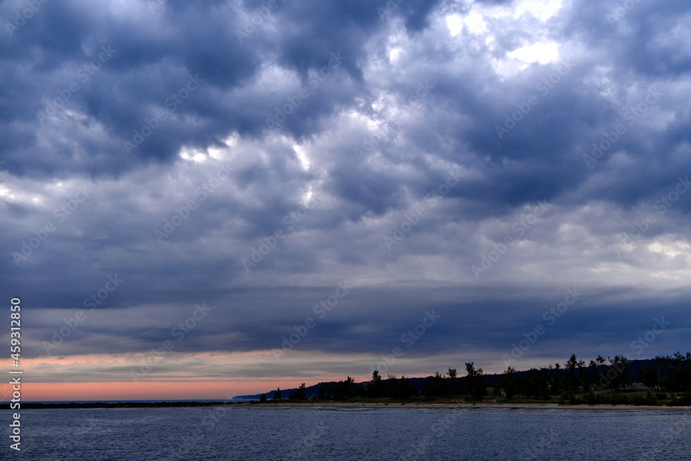 Billowing Clouds over Muskegon Channel shoreline