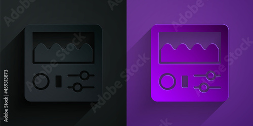 Paper cut Drum machine icon isolated on black on purple background. Musical equipment. Paper art style. Vector