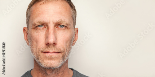 Male close-up studio portrait isolated against white background. Bearded man headshot.