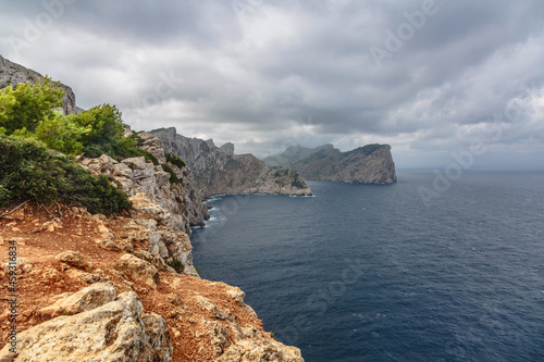 Landscape of rocky coast before a storm under gloomy dramatic sky