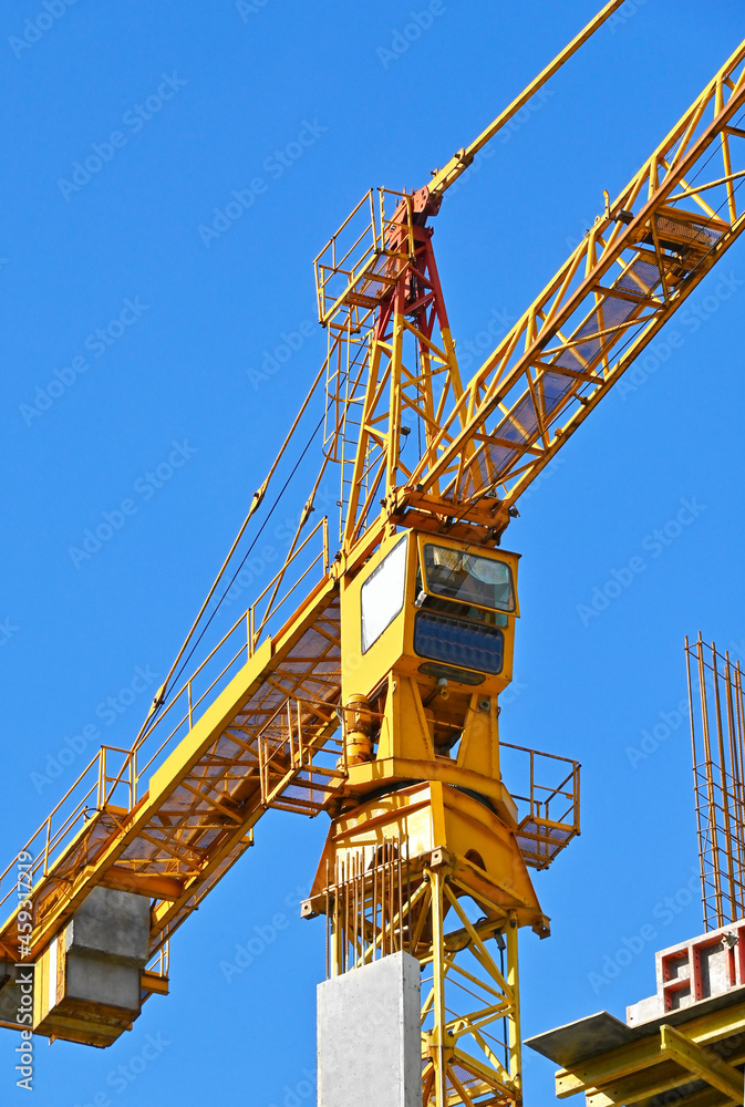Crane and highrise construction site Crane and highrise construction site