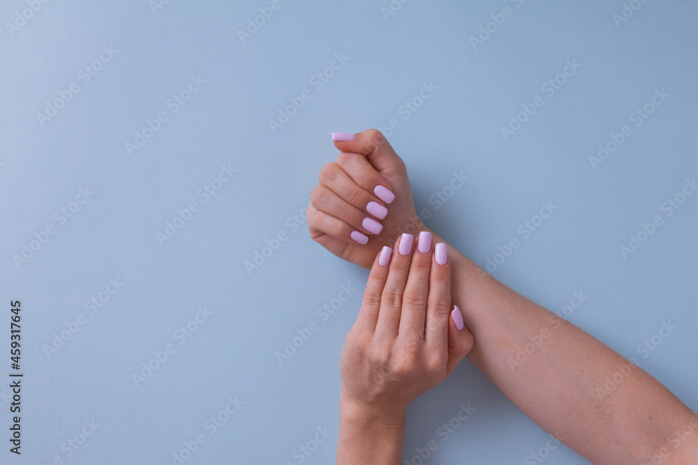 Closeup of hands of a young woman with pink manicure. Closeup of hands of a young woman with pink manicure.