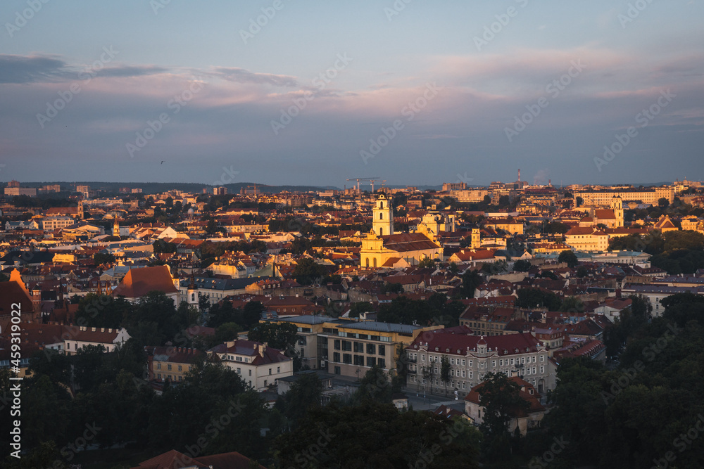 VIlnius / Lithuania - August 12 2021: View over the Old Town of Vilnius in summer at sunrise, amazing baltic touristic city in Lithuania, Europe