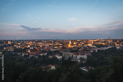 VIlnius / Lithuania - August 12 2021: View over the Old Town of Vilnius in summer at sunrise, amazing baltic touristic city in Lithuania, Europe