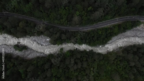 Aerial view of the river and the road in Russia, top view of the forest in the mountains