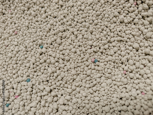 A close up shot of bentonite white colored pet litter sand  