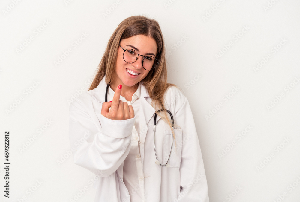 Young doctor Russian woman isolated on white background pointing with finger at you as if inviting come closer. Young doctor Russian woman isolated on white background pointing with finger at you as if inviting come closer.
