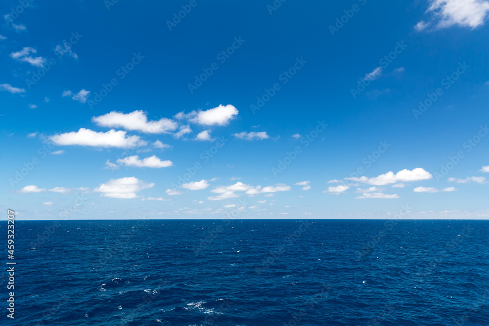 Seascape. Blue sky and white cloud.