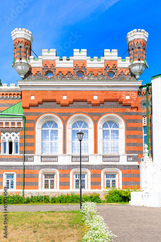 Sheremetev castle palace and park ensemble in the village of Yurino on the bank of the Volga, combination of different architectural styles in one building. Cloudy weather at the beginning of summer.